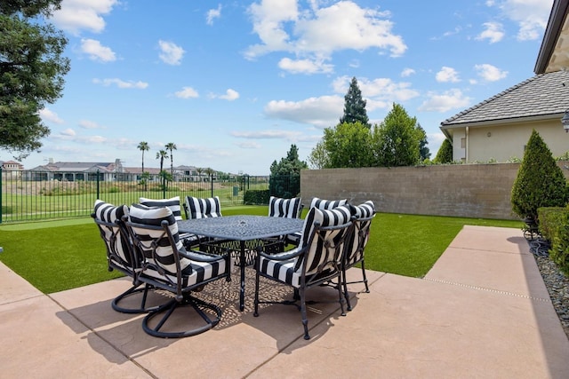 view of patio / terrace featuring outdoor dining space and a fenced backyard