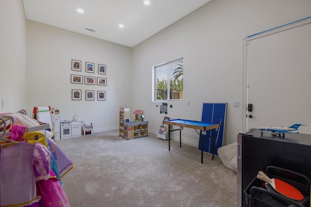 recreation room with carpet, visible vents, baseboards, and recessed lighting