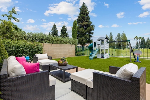 view of patio / terrace featuring fence, outdoor lounge area, and a playground