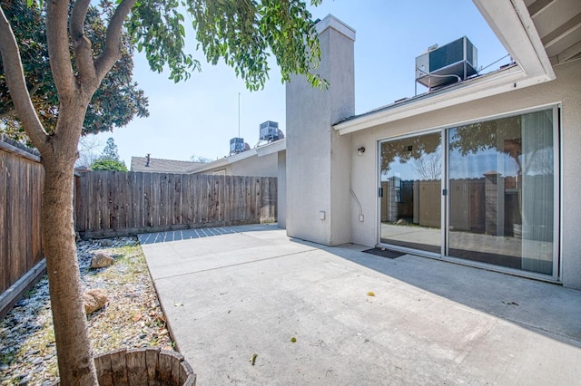 view of patio / terrace featuring central AC and a fenced backyard