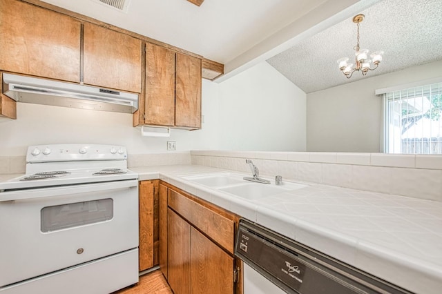 kitchen featuring under cabinet range hood, electric range, a sink, dishwasher, and brown cabinetry