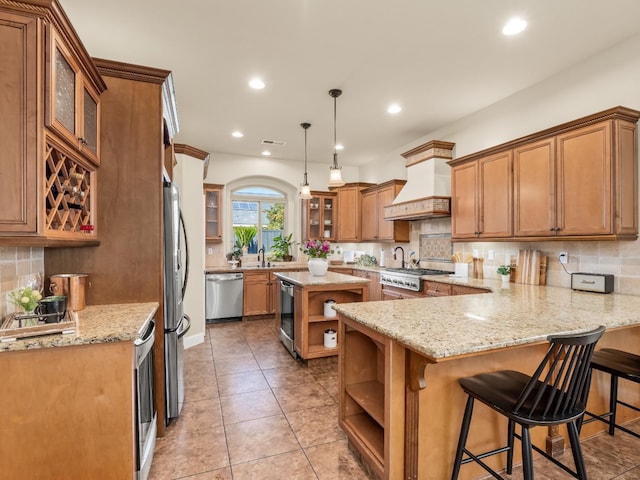 kitchen with appliances with stainless steel finishes, light stone counters, custom exhaust hood, and open shelves