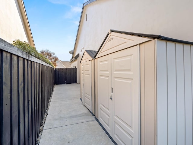 view of outbuilding featuring a fenced backyard