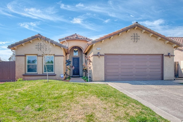 mediterranean / spanish-style house featuring stucco siding, an attached garage, fence, driveway, and a front lawn