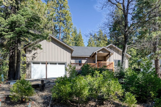 view of front of property with board and batten siding and roof with shingles