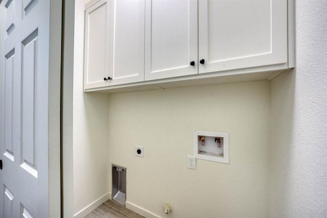 40865 Cold Springs Ln, Shaver Lake, CA 93664 - washroom featuring cabinet space, electric dryer hookup, washer hookup, baseboards, and light wood-style flooring
