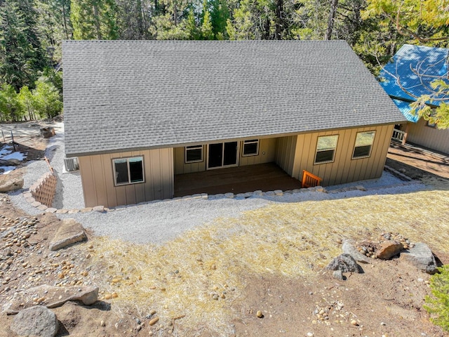 40865 Cold Springs Ln, Shaver Lake, CA 93664 - chalet / cabin featuring roof with shingles, board and batten siding, and view of scattered trees