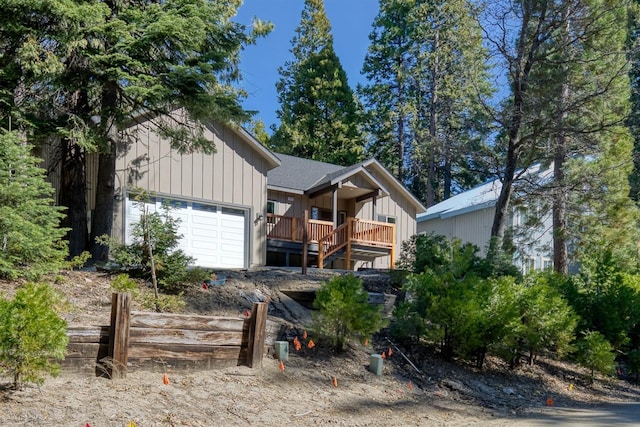 40865 Cold Springs Ln, Shaver Lake, CA 93664 - view of front facade featuring a garage and board and batten siding