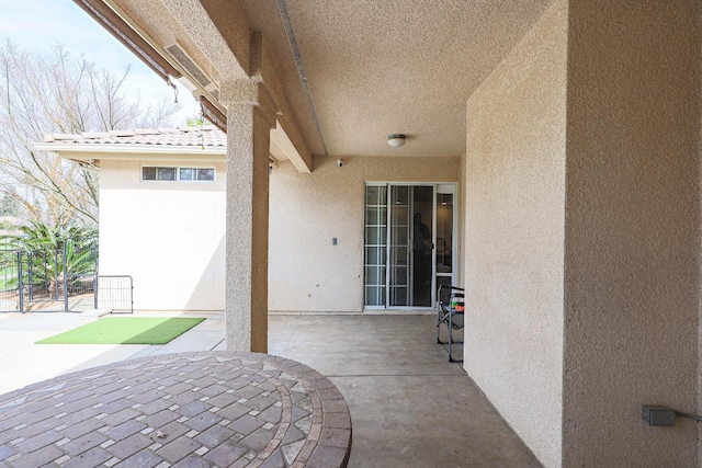 view of patio featuring a gate