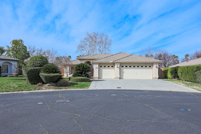 single story home featuring driveway, a tile roof, an attached garage, and stucco siding