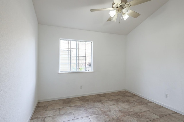 spare room featuring baseboards and a ceiling fan