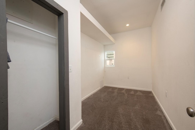 unfurnished bedroom with recessed lighting, visible vents, dark carpet, and baseboards