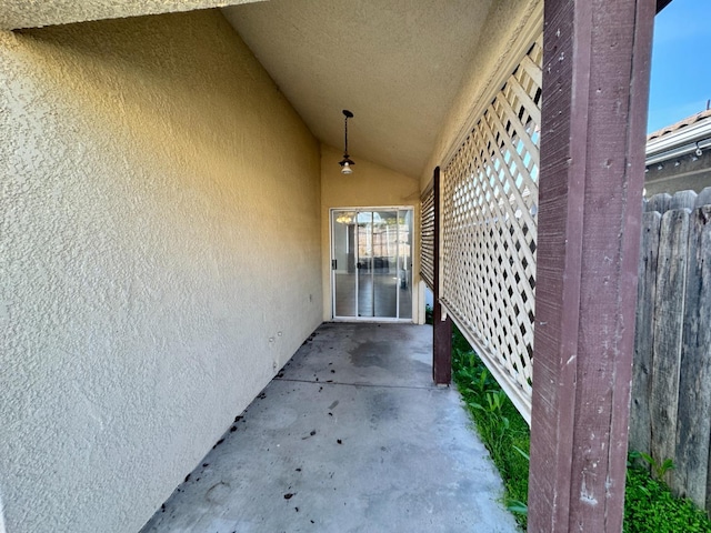 doorway to property with stucco siding