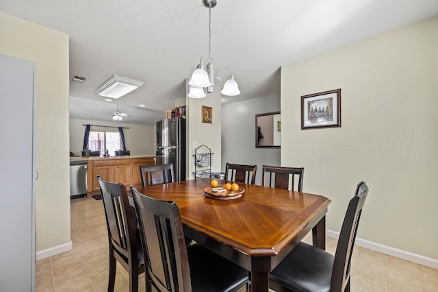 dining room featuring a chandelier, light tile patterned floors, visible vents, and baseboards