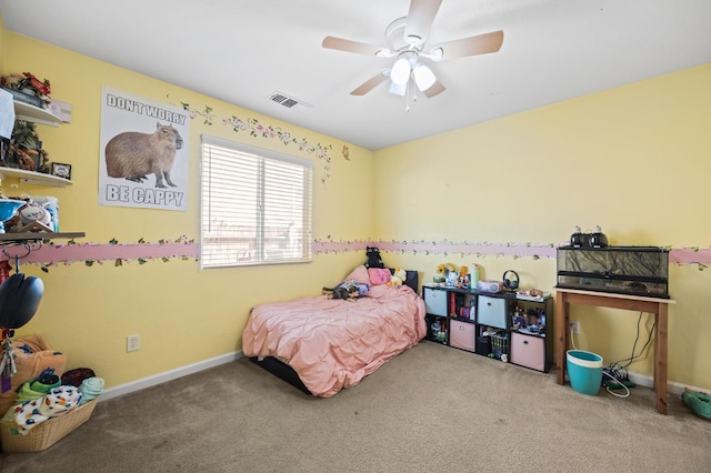 carpeted bedroom featuring baseboards, visible vents, and a ceiling fan