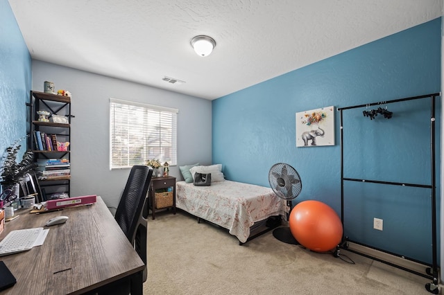 bedroom with a textured wall, carpet floors, a textured ceiling, and visible vents