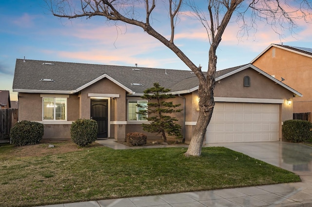 ranch-style house featuring a garage, driveway, a front lawn, and stucco siding