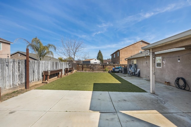 view of yard with a patio area and a fenced backyard