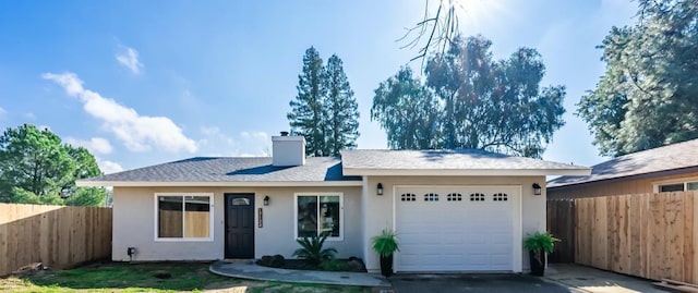 single story home featuring driveway, fence, a chimney, and an attached garage