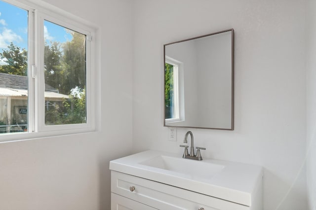 bathroom featuring a wealth of natural light and vanity