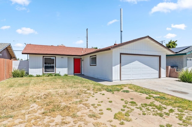 single story home featuring a garage, fence, concrete driveway, and a front yard