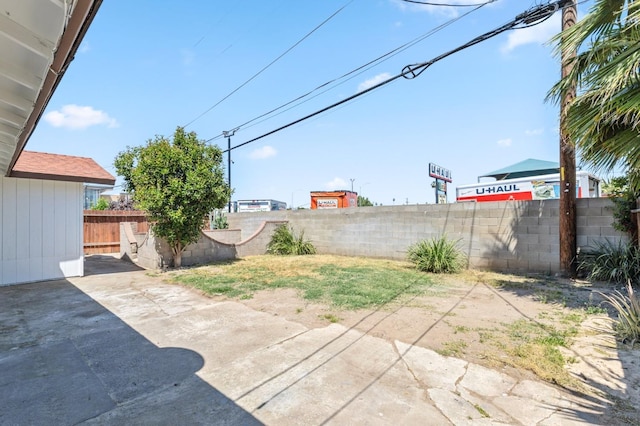 view of yard featuring a patio area and a fenced backyard