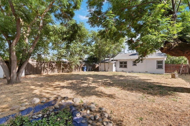 view of yard with a fenced backyard