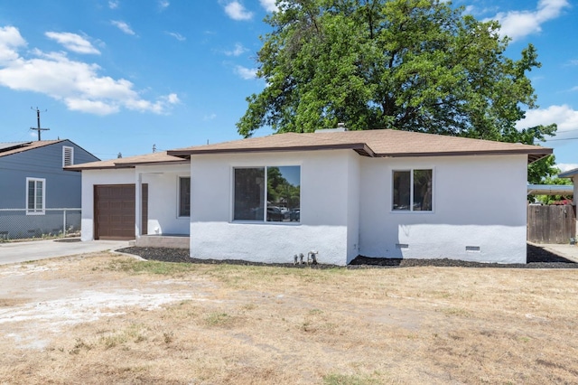 single story home with an attached garage, fence, concrete driveway, crawl space, and stucco siding