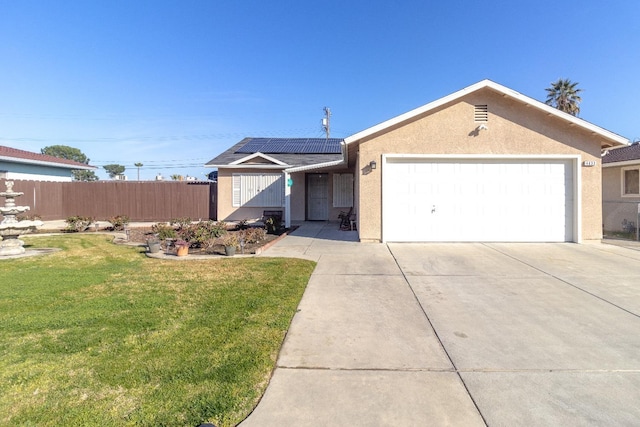 ranch-style home with stucco siding, driveway, a front lawn, fence, and solar panels