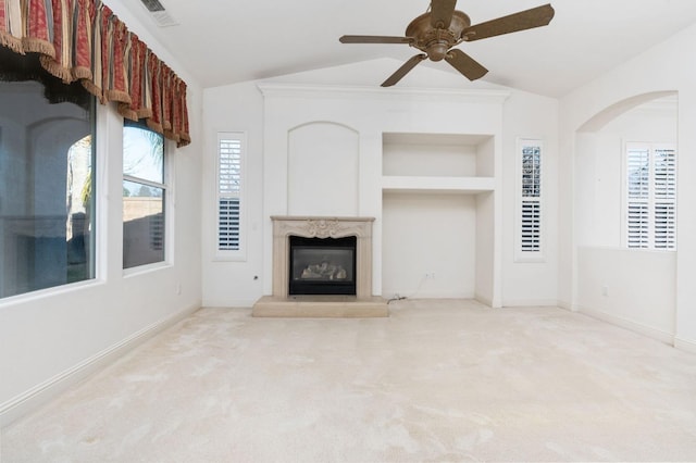 unfurnished living room featuring lofted ceiling, carpet floors, visible vents, and built in features