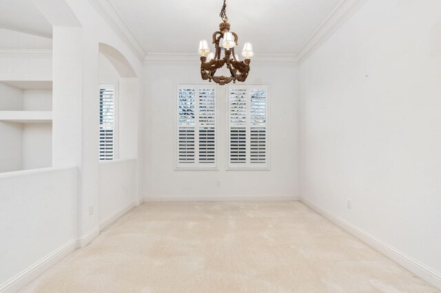 unfurnished room featuring ornamental molding, carpet flooring, and baseboards