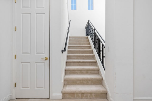 stairs featuring baseboards