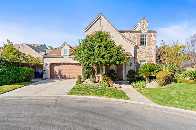 view of front of property featuring stone siding, an attached garage, driveway, and stucco siding