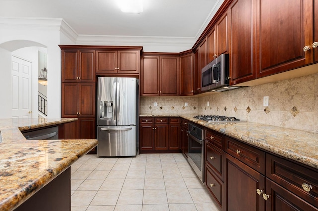 kitchen featuring light stone counters, crown molding, light tile patterned floors, stainless steel appliances, and backsplash