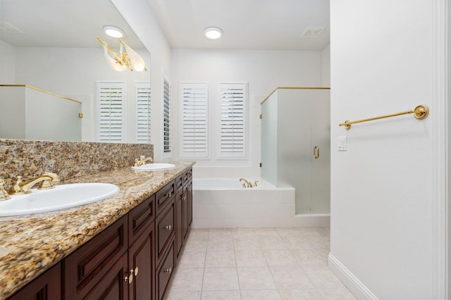 bathroom featuring tile patterned flooring, a sink, a shower stall, and a bath