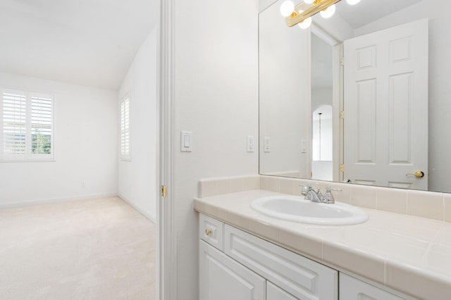 bathroom featuring vanity and baseboards