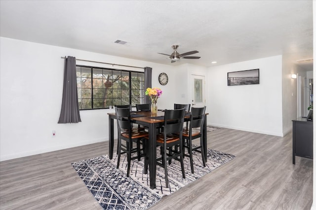 29598 Jim Bowie Ct, Coarsegold, CA 93614 - dining room with visible vents, baseboards, and wood finished floors