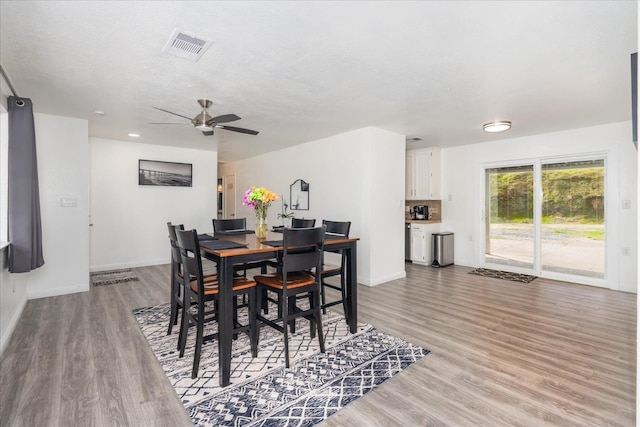 29598 Jim Bowie Ct, Coarsegold, CA 93614 - dining room with light wood-type flooring, visible vents, baseboards, and ceiling fan