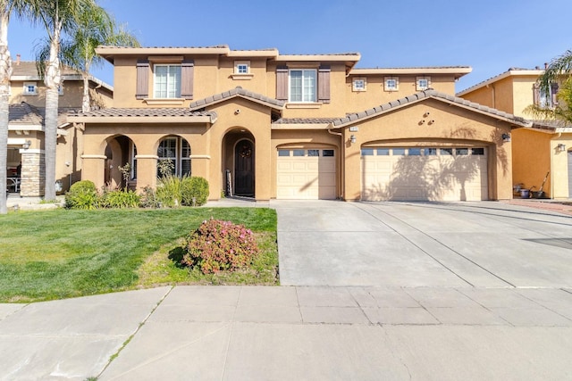 mediterranean / spanish home featuring a tiled roof, a front lawn, concrete driveway, and stucco siding