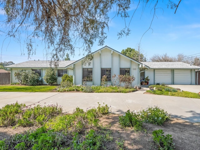 view of front of house with a garage and concrete driveway