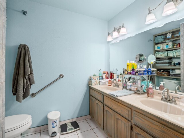 11952 Trieste Dr, Madera, CA 93636 - full bath featuring tile patterned flooring, a sink, toilet, and double vanity