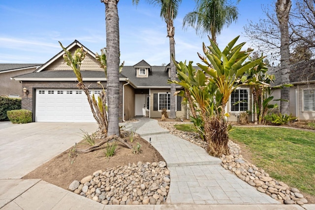 view of front of home featuring a garage and concrete driveway