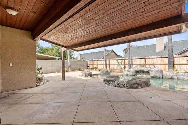 view of patio with a fenced in pool and a fenced backyard