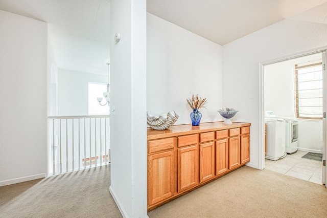 4466 W Artemisa Dr, Fresno, CA 93722 - hall featuring light carpet, baseboards, and washer and clothes dryer