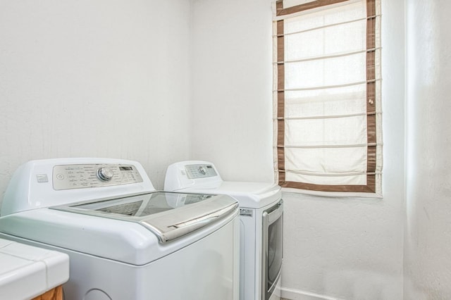 4466 W Artemisa Dr, Fresno, CA 93722 - washroom with washer and dryer and laundry area