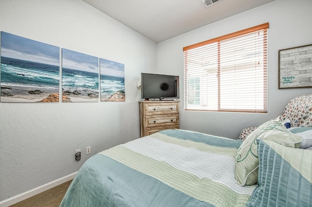 4466 W Artemisa Dr, Fresno, CA 93722 - carpeted bedroom with baseboards and a textured wall