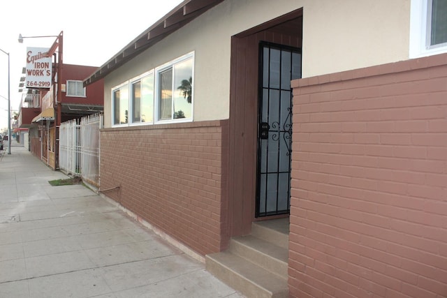 view of side of property with brick siding