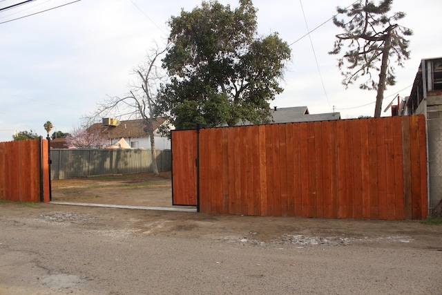 view of gate featuring fence