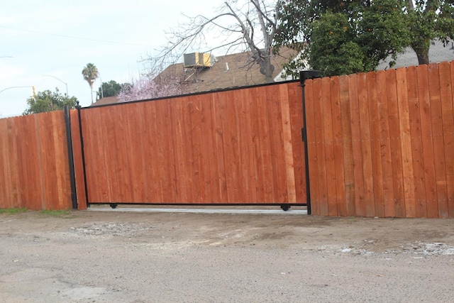 view of gate featuring fence