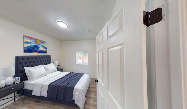 bedroom featuring wood finished floors